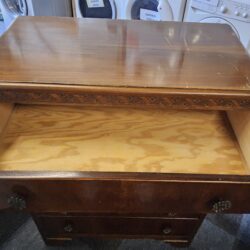 Vintage Harris Lebus 5-drawer chest of drawers featuring decorative wood carving along the top trim and ornate metal handles (1026146)